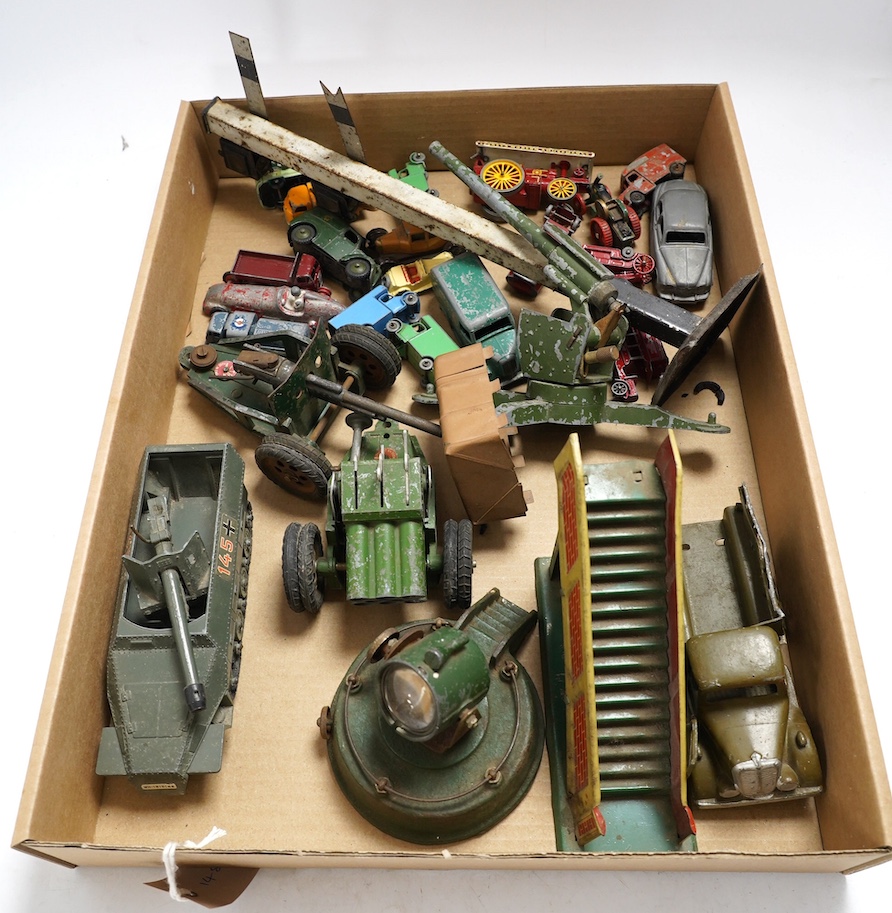 A collection of diecast toys, including an early Britains half-track army troop transporter, Matchbox vehicles, an Astra field gun, etc. Condition - poor